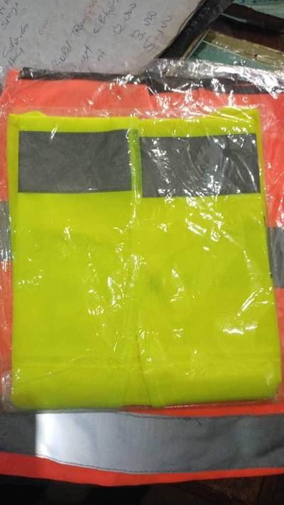 Hi-vis reflective vests — site ppe held by LAMM Investment Company.